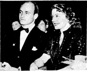 Mr. James Roosevelt, son of the President of the United States, with Miss Ruth Selwyn at the ring side during the 12-rounds boxing 'match between the Englishman Tommy Farr and the American "Red" Bur man, which took place at the Harringay Stadium, London, on April J3, (Evening Post, 06 May 1939)
