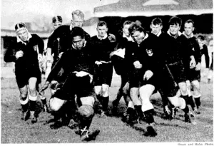 Vaatau, half-back for Canterbury University College, getting the ball away in,the face of hot pursuit by the opposing pack, led by McNicol, in the match against the New Zealand University team, played -: •■ — ~at Lancaster Park, Christchurch, yesterday. ".' (Evening Post, 06 June 1939)