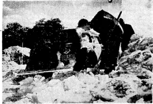 A snow-plough at work on the road to the Chateau, Tongariro National Park. Below, one of the cars ivhich was buried in snow this • week on the same road. (Evening Post, 03 August 1939)