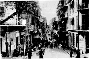 Sport and General" Photo. Wellington Street, one of the principal streets of the native quarter of Hong Kong. On the right are the offices of the "China Mail," an influential newspaper published each evening in Hong Kong. (Evening Post, 07 September 1939)