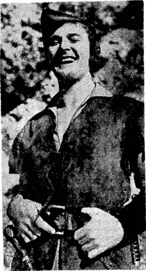 Errol fr'lynn, who makes a coiouriui Robin Hood in;"The Adventures ol Robin Hood," which remains at ne Regent Theatre for a fourth week. Olivia de Havilland, Claude Rains, and Basil Rathbone are in the cast. (Evening Post, 02 February 1939)