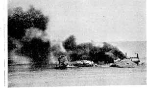 ON THE SHORES OF BRITAIN—Like hundreds of others a shot-c'cvn German bomber lies crashed all{j burning on tlie\shores of Britain It symbolises how Germany s ruthless air attack is breaking like an evil wave on the shores of Britain. (Rodney and Otamatea Times, Waitemata and Kaipara Gazette, 29 January 1941)