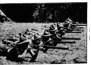 NO TIME IS LOST.—New ZealanderH in England, at rifle practice. (Rodney and Otamatea Times, Waitemata and Kaipara Gazette, 19 February 1941)