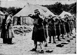 RIFLE PRACTICE claims King George's attention during a visit he paid, to New Zealand troops. ■ . s (Rodney and Otamatea Times, Waitemata and Kaipara Gazette, 12 February 1941)