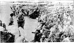 CAPTURED ITALIAN COLONIAL INFANTRY (Native) resting (luring a march through Abyssinia to prison camps. ' (Rodney and Otamatea Times, Waitemata and Kaipara Gazette, 03 December 1941)