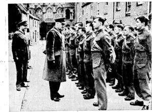 THEY WANT TO FLY.—Air Commodore A. C. Critohley inspecting: a parade of men of the British Army who have transferred to the R.A.IP. . (Rodney and Otamatea Times, Waitemata and Kaipara Gazette, 10 December 1941)