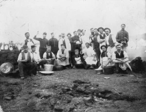 Group including kitchen workers, at a military camp