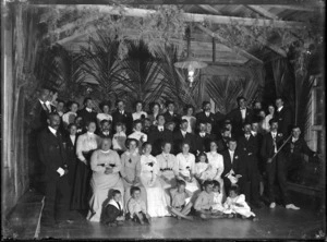 Group at bush ball, in the hall at the Piha Mill.