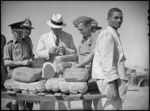 Prime Minister Peter Fraser inspects bread, Egypt