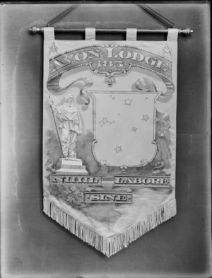 A banner, which is decorated with a picture of a statue of Captain Robert Falcon Scott, and writing that reads 'Avon Lodge 185 Nihil labore sine'