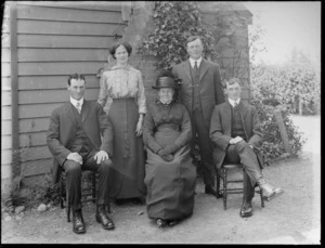 Unidentified family group, in a garden, probably Christchurch district
