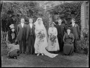Unidentified wedding group, including bride, groom, bridesmaid, and minister, probably Christchurch district