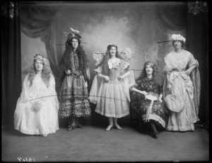 Studio portrait of five unidentified women wearing theatrical costumes