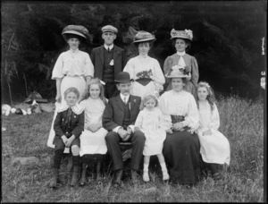 Family group, members unidentified, including children wearing lace collars, in an outdoor location, possibly Christchurch district