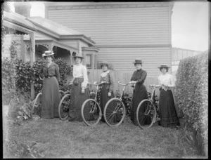 Unidentified women, with bicycles in a garden, probably Christchurch district