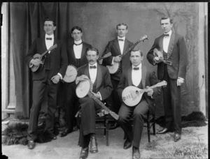 Studio portrait of six unidentified banjo players with instruments, probably Christchurch district
