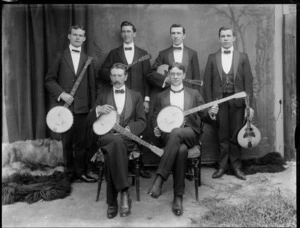 Studio portrait of six unidentified banjo players with instruments, probably Christchurch district