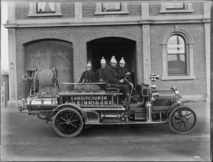 Sydenham Fire Brigade, Christchurch, shows unidentified firemen on fire truck outside Sydenham Borough Council chambers