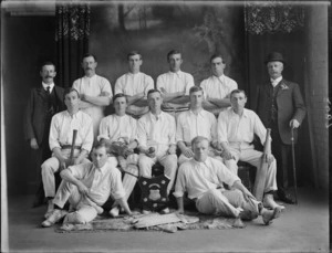 Studio portrait of unidentified men's cricket team with United Ancient Order of Druids trophy sheild, probably Christchurch district