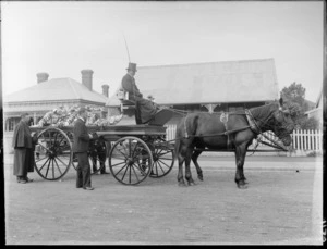 Unidentified funeral, houses pulling cart and driver, men walking along side of cart, probably Christchurch district