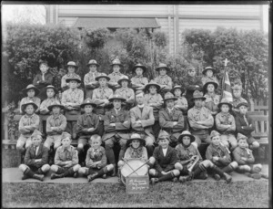 Saint Saviour's Boy Scouts Troop, unidentified boys and adults in scout uniforms with Anglican Priest, bugle, drum and flag, 30 Oct 1920 sign, Christchurch