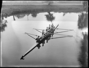 Unidentified coxed four men's rowing team with a young boy coxswain on the Avon River, Christchurch