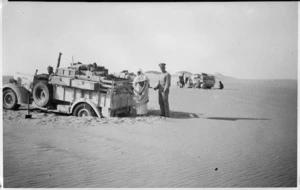 Trucks of Long Range Desert Group bogged in dune country, Libya