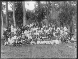 Large unidentified group outdoors, probably Christchurch district, including tall gum trees in the background