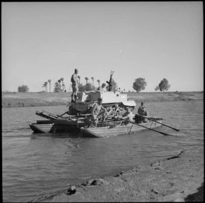 Bren gun carrier transported by collapsible assault boat ferry, Nile River