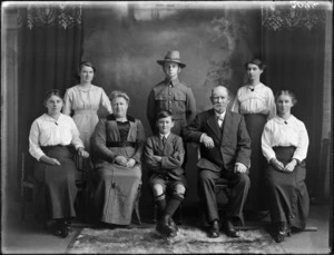 Studio portrait of unidentified family, includes a young man in military uniform, probably Christchurch district