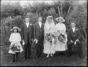 Unidentified wedding party outdoors, showing bride and groom, bridesmaids and groomsmen, probably Christchurch district