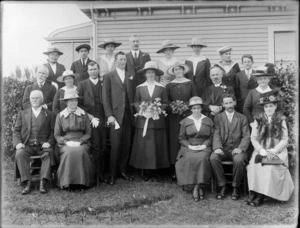 Unidentified wedding group, showing bride and groom, bridesmaid, groomsman and family members, including a priest, probably Christchurch district