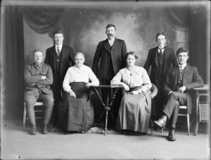 Studio portrait of unidentified family group, including a man in army uniform, probably Christchurch district