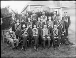 Unidentified group of men from the Hibernian Australasian Catholic Benefit Society, wearing long collars with either stars or flowers on the front, probably Christchurch district