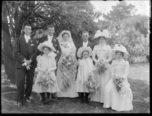 Unidentified wedding group outdoors, probably Christchurch district, showing bride and groom, groomsman, bridesmaids, flowergirls [and father of bride?]