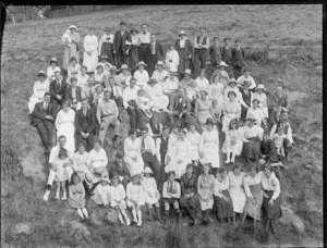 Large group of unidentified men, women and children, on a steep hillside, possibly Christchurch district