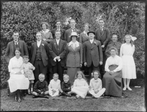 Group of unidentified men, women and children, in a garden, possibly Christchurch district