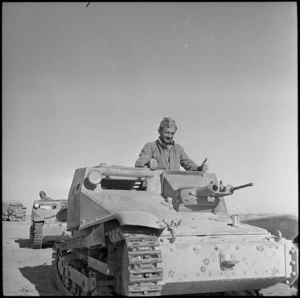 NZ driver examining Italian tank, Western Desert