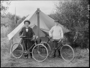 Two unidentified men with bicycles, in front of a tent, possibly Christchurch district