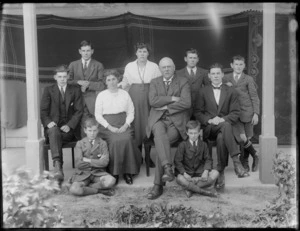 Family group, showing unidentified men, women and children, in an outdoor location, possibly Christchurch district