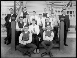 Group of young men sitting on the steps of a pavilion, probably Christchurch district