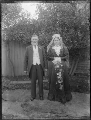 Wedding portrait of an elderly couple, in a garden, possibly Christchurch district