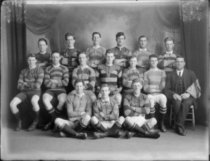 Studio portrait of unidentified young men's rugby [union?] football team in uniform, with coach, ball and flag, Christchurch