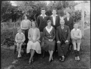 Unidentified family group portrait, three men, three women, a girl and two boys, taken in the garden, probably Christchurch district