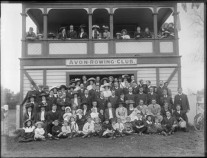 Unidentified members of the Avon Rowing Club, Christchurch, showing some members on the balcony and some members in front of the building