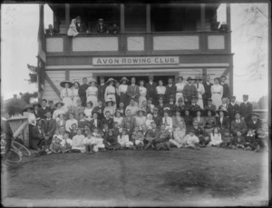 Unidentified members of the Avon Rowing Club, Christchurch, showing some members on the balcony and other members in front of the building