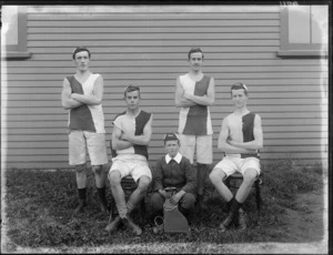 A group of unidentified rowers and coxman, in front of a building, possibly Christchurch district