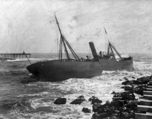 The steam ship "Hawea" run ashore at the entrance to the Grey River, Greymouth