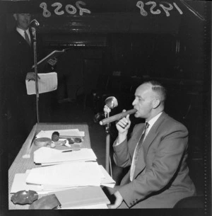 Mr K W Frazer smoking a gigantic cigar