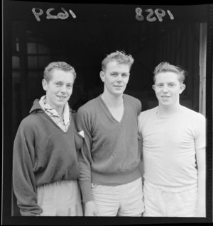 Three unidentified male basketball players